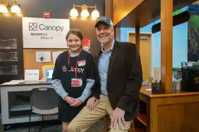 Canopy Team Members with JA BizTown Student at a Canopy Kisok in JA BizTown