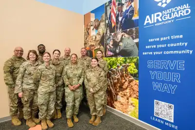 Members of the Kentucky Air National Guard in front of display