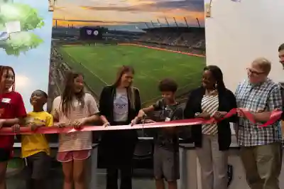 People Cutting a Ribbon to the Louisville City FC and Racing Louisville FC Storefront