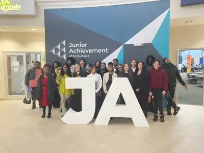 Picture of Youth in Front of JA Letters